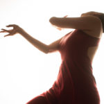 Leyya Mona Tawil dancing in a red dress