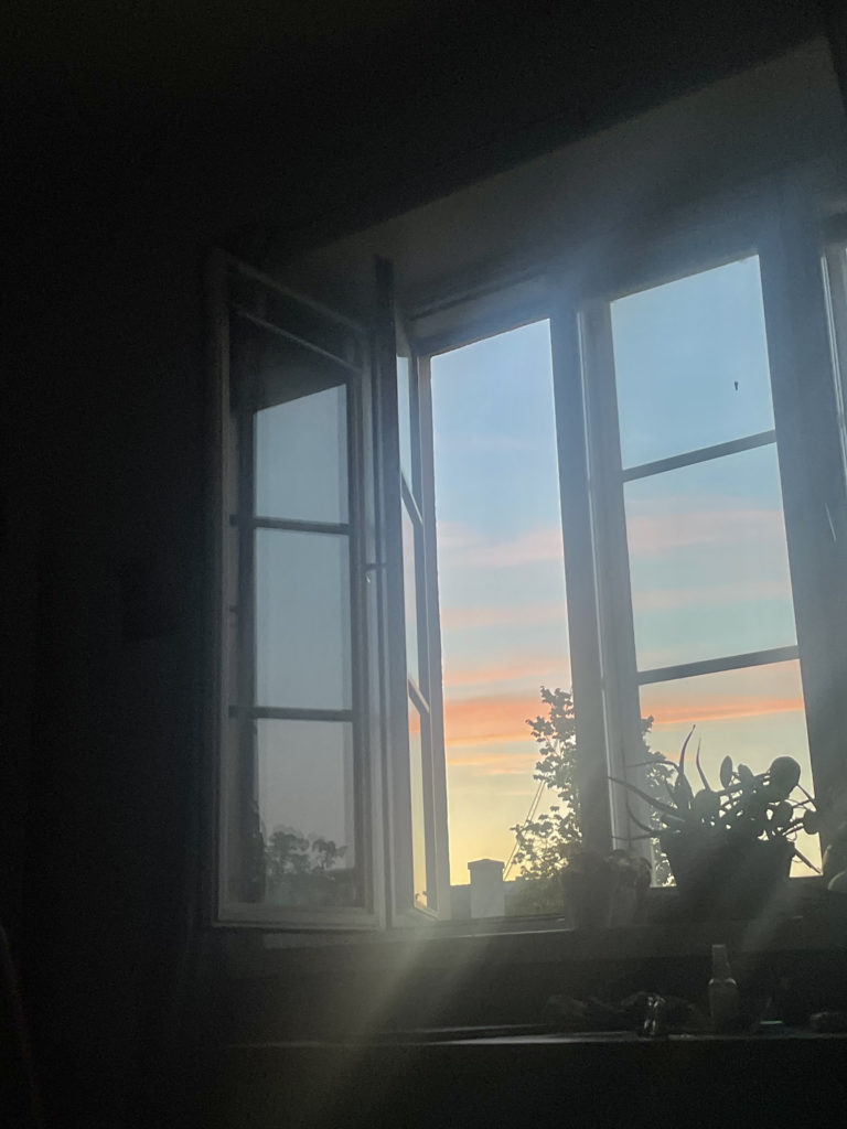 Picture of a sunrise outside a window