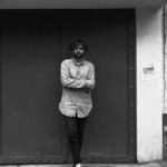 Black and white photo of Diego Aguirre Fernández leaning against a wall