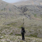 person standing in a misty mountain scenery